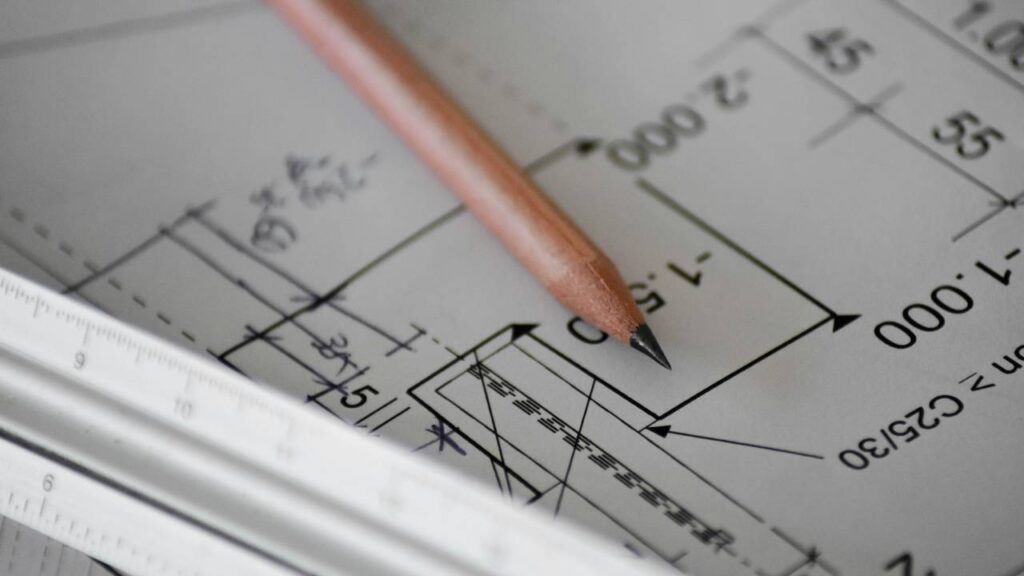 A pencil placed on a project plan