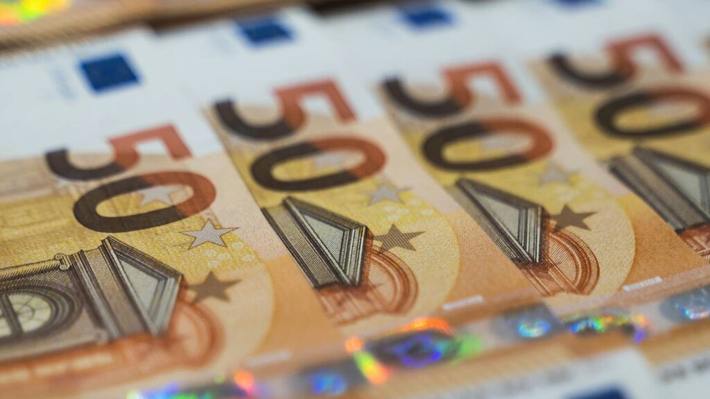 A close-up photo of a stack of several 50-Euro bills