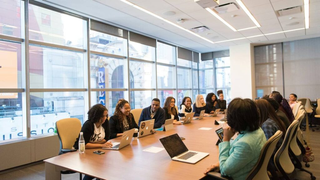 Employees talking to each other in their company's conference room 